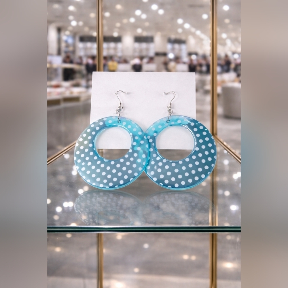 Blue Circle dangly earring with white polka-dots.